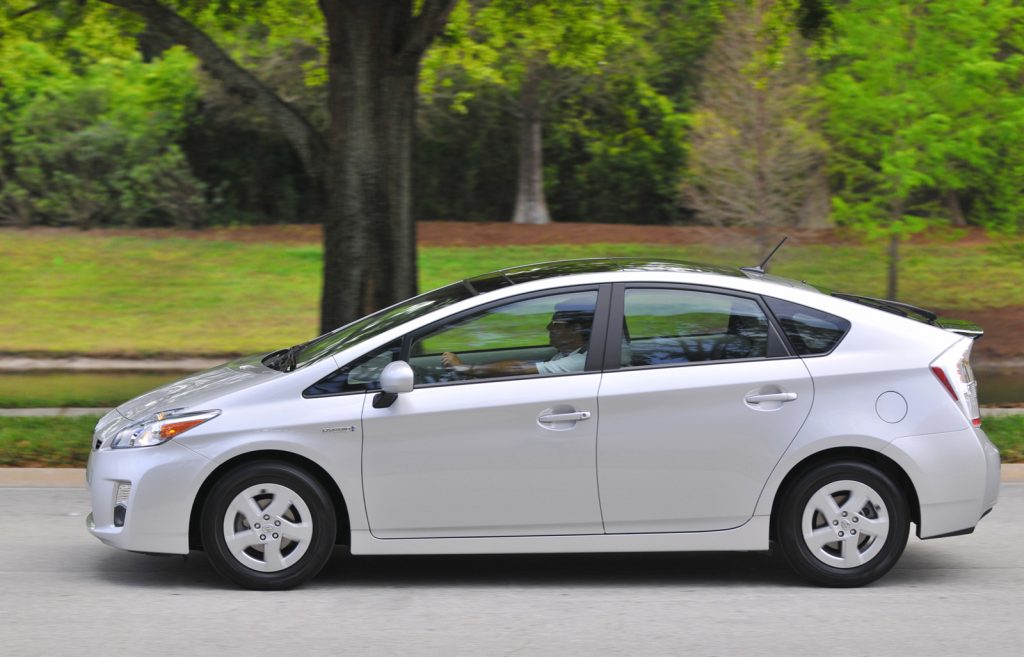 Grey Toyota Prius Driving on the road