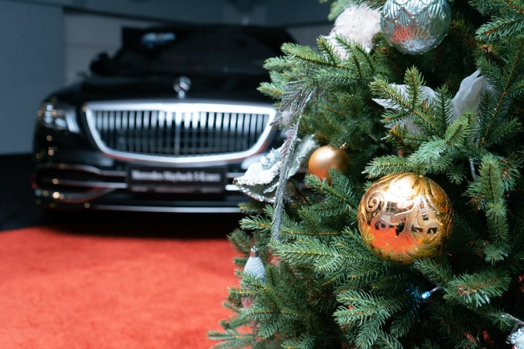 Christmas Tree with a Mercedes Benz in the background