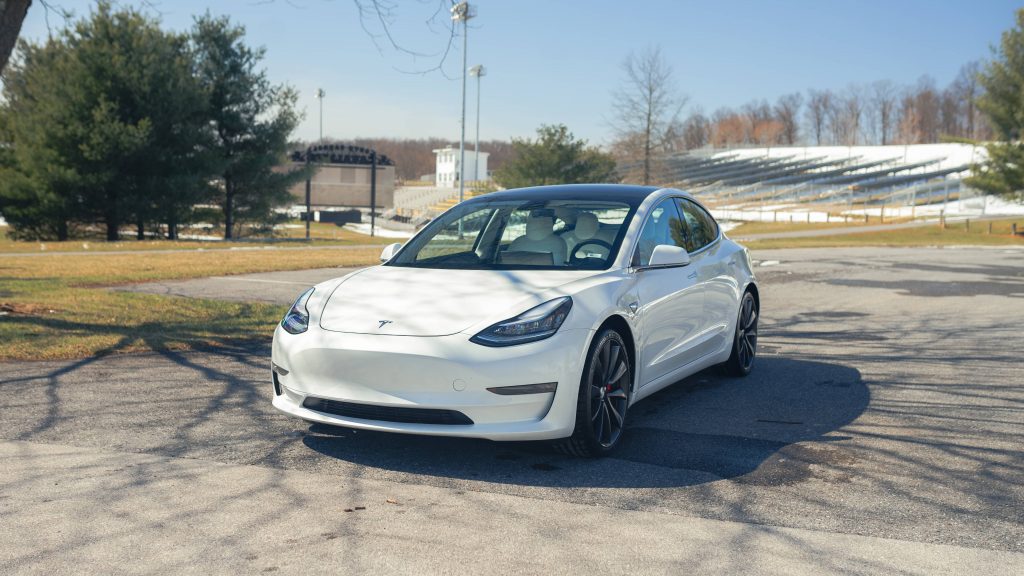 Used White Tesla parked on the road